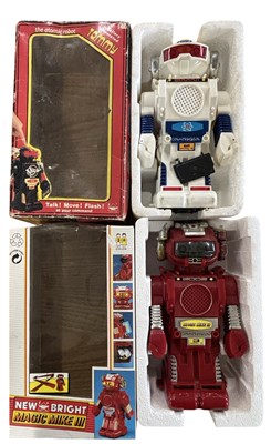 Lot 300 - A pair of vintage boxed robot toys, to include:...
