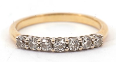 Lot 31 - A diamond ring, set with seven round brilliant...
