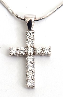 Lot 88 - An 18ct diamond cross pendant and chain, the...