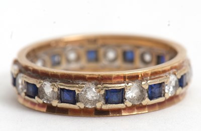 Lot 70 - A 9ct eternity ring, set with square blue...