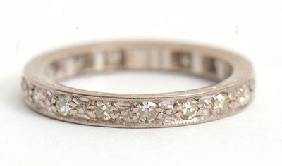 Lot 76 - An 18ct diamond eternity ring, set throughout...