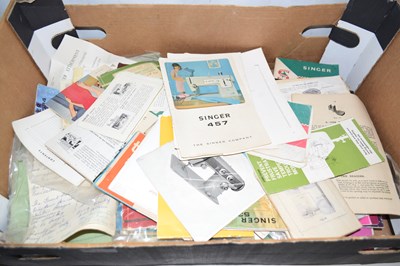 Lot 23 - A box of various sewing machine instruction...
