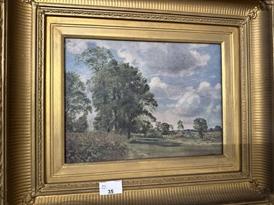 Lot 35 - An oleograph study of a rural scene with cart,...