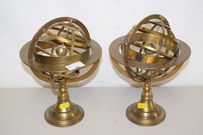 Lot 59 - A pair of reproduction brass table armillary...