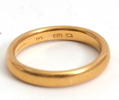 Lot 173 - A 22ct gold wedding band, 3.5mm thick, stamped...