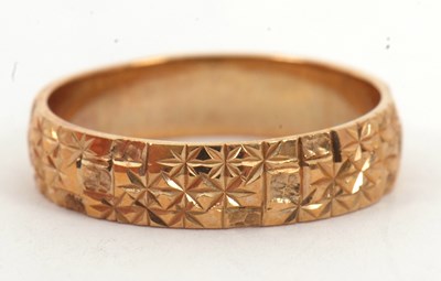 Lot 44 - A 9ct wedding band, 4.8mm wide, with all...