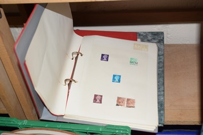 Lot 507 - Three stamp albums containing a sparse...