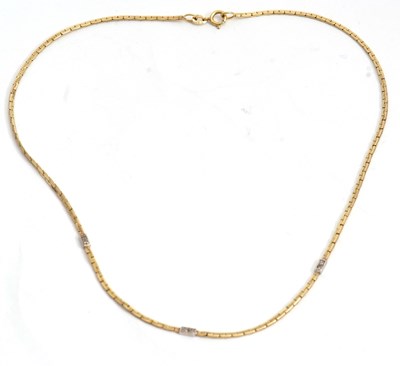 Lot 212 - A 9ct diamond set necklace, the yellow gold...