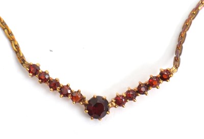 Lot 129 - A 9ct garnet necklace, set with a central...