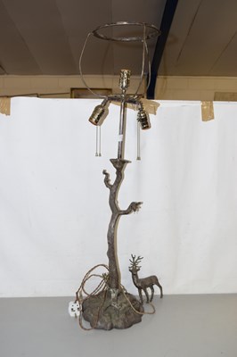 Lot 189 - A cast metal table lamp formed as a tree trunk...