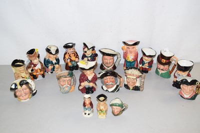 Lot 202 - A collection of various small character jugs...