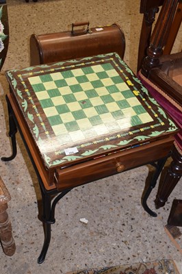 Lot 284 - A modern painted games table on iron stand