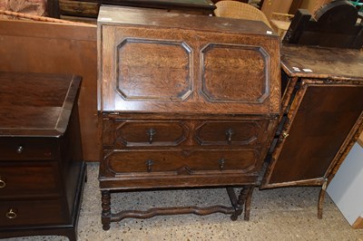 Lot 303 - An early 20th Century oak bureau