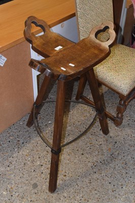 Lot 306 - An oak and iron framed stool