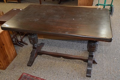Lot 324 - A dark oak effect rectangular dining table