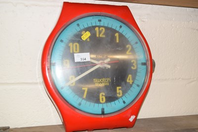 Lot 354 - A Swatch watch shaped wall clock