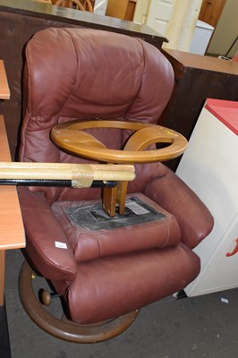 Lot 747 - An easy chair and matching footstool