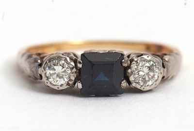 Lot 72 - A sapphire and diamond ring, the central...