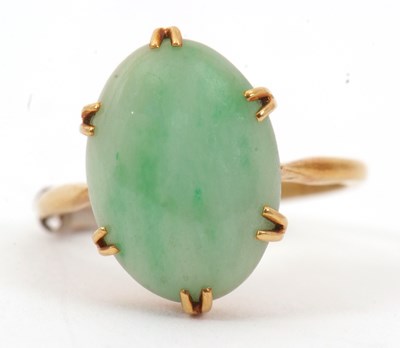 Lot 37 - An 18ct jade ring, the oval jade cabochon, 15...