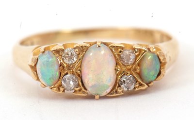 Lot 38 - An opal and diamond ring, with three oval opal...