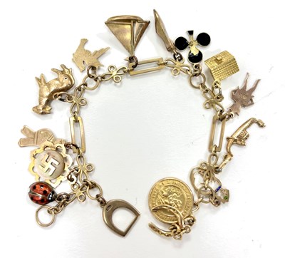 Lot 205 - A charm bracelet, the unmarked fancy link...