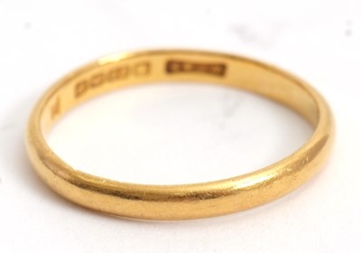Lot 210 - A 22ct wedding band, 2.5mm wide, hallmarked...