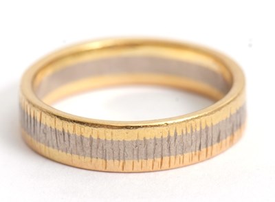 Lot 200 - A 18ct tri-colour gold band, with yellow,...
