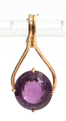 Lot 127 - An amethyst pendant, the round mixed cut...