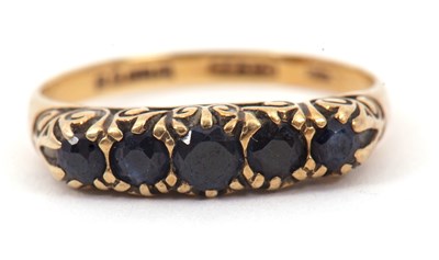 Lot 46 - A 9ct five stone sapphire ring, the slightly...