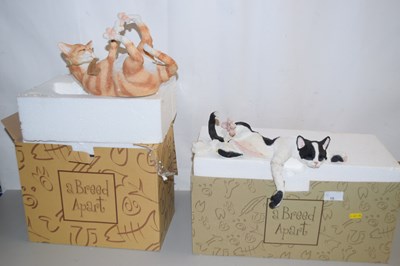 Lot 16 - Two modern resin models of cats