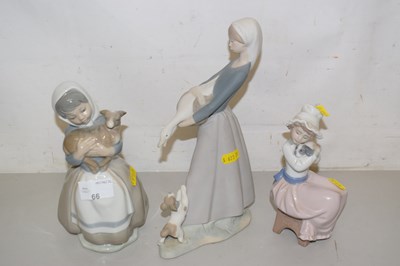 Lot 66 - A group of three Lladro and Nao figures