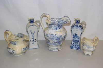 Lot 185 - A group of three Victorian blue and white jugs...