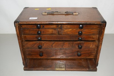 Lot 241 - A table top oak cabinet with seven drawers