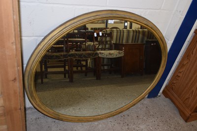 Lot 276 - A large oval gilt framed wall mirror