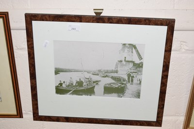 Lot 293 - A black and white photograph of figures before...