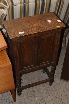Lot 308 - An early 20th Century oak two door cupboard on...