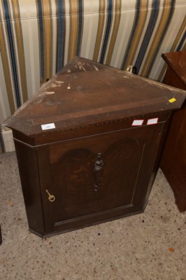 Lot 309 - A 20th Century oak wall mounted corner cabinet