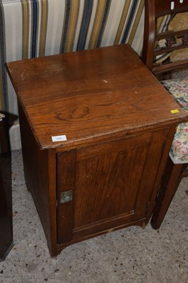 Lot 310 - An oak single door bedside cabinet