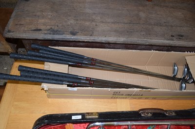 Lot 324 - A box of golf clubs