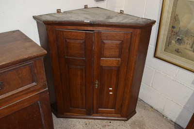 Lot 374 - A Georgian oak wall mounted corner cabinet