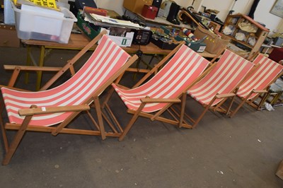 Lot 760 - Set of four matching wooden deckchairs