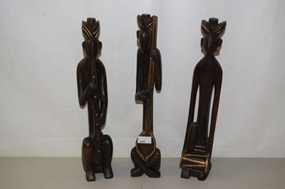 Lot 640 - Three hardwood figures of musicians