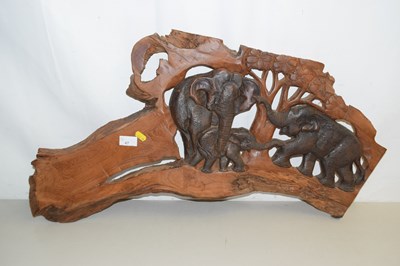 Lot 47 - A hardwood wall plaque depicting an elephant...