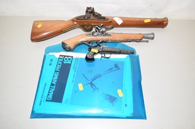 Lot 58 - A group of two reproduction flint lock guns,...