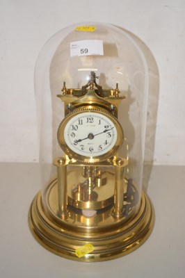 Lot 59 - A dome top anniversary clock set on a brass base