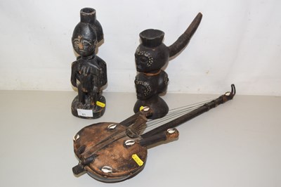 Lot 61 - An African stringed instrument and two figures