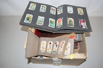 Lot 90 - A collection of various albums of cigarette cards