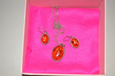Lot 144 - Modern amber pendant and matching earrings