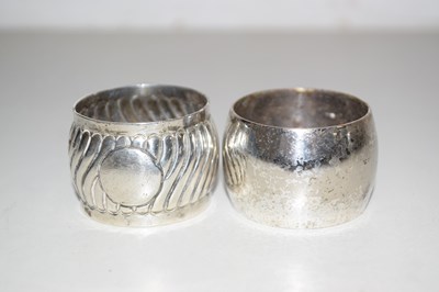 Lot 156 - A silver napkin ring and a further plated example