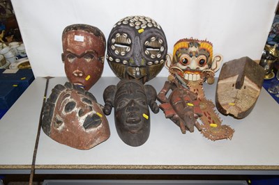 Lot 203 - Group of seven carved softwood wall masks,...